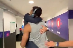 Gianmarco Pozzecco runs into Giannis Antetokounmpo after emotional win