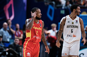 Spain beats Germany in close battle behind Brown and Schroder's masterpieces