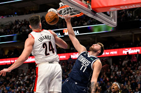 Luka Doncic reacts to his poster dunk vs. Trail Blazers